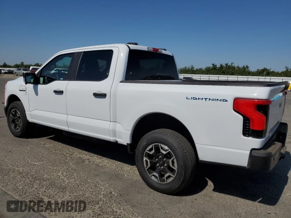2023 Ford F-150 Lightning Pro with VIN 1FT6W1EVXPWG44972, listed as a Copart auction lot 60303485 with 19,788 mi miles and Salvage title. Bid and sale history available at DreamBid. Image 2.