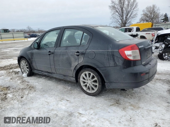 2011 Suzuki SX4 with VIN JS2YC5A44B6300171, listed as a Copart auction lot 87673685 with 116,483 mi miles and Salvage Title. Bid and sale history available at DreamBid. Image 2.