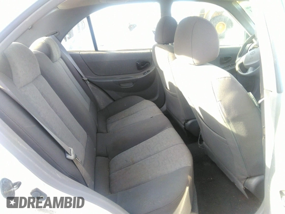 2004 Hyundai Accent GL with VIN KMHCG45C04U498939, listed as a IAAI auction lot 41384821 with 247,994 mi miles. Bid and sale history available at carsss.com. Image 8.