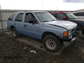 1992 Isuzu Rodeo z VIN 4S2CY58Z2N4333410, wystawiony jako Copart lot #74507154 z przebiegiem 264 327 mil mil oraz Szkody całkowita. Historia ofert i sprzedaży dostępna na DreamBid. Obrazek 4.