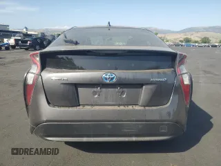 2016 Toyota Prius Two z VIN JTDKBRFU7G3520531, wystawiony jako Copart lot #57690325 z przebiegiem Nie podano mil oraz Czysty tytuł • Clean title. Historia ofert i sprzedaży dostępna na DreamBid. Obrazek 6.