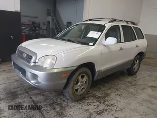 2004 Hyundai Santa Fe GLS with VIN KM8SC13E44U797943, listed as a IAAI auction lot 41731356 with 184,139 mi miles. Bid and sale history available at carsss.com. Image 2.