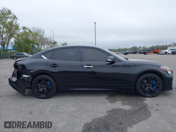 2015 Infiniti Q70 z VIN JN1BY1AR6FM561165, wystawiony jako IAAI lot #41622832 z przebiegiem 121 522 mil mil oraz . Historia ofert i sprzedaży dostępna na DreamBid. Obrazek 14.
