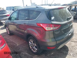 2014 Ford Escape Titanium with VIN 1FMCU9J98EUB66961, listed as a IAAI auction lot 42057914 with 101,943 mi miles. Bid and sale history available at carsss.com. Image 3.