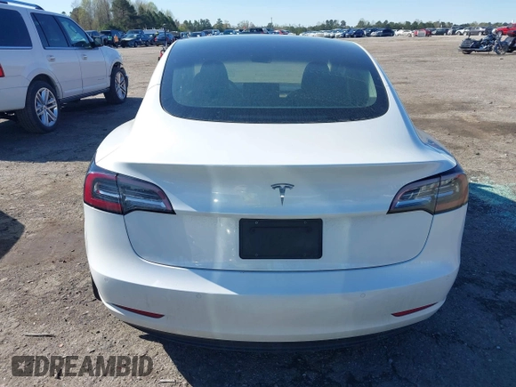 2020 Tesla Model 3 Standard Range Plus with VIN 5YJ3E1EA7LF797150, listed as a IAAI auction lot 41869088 with 75,708 mi miles and . Bid and sale history available at carsss.com. Image 16.