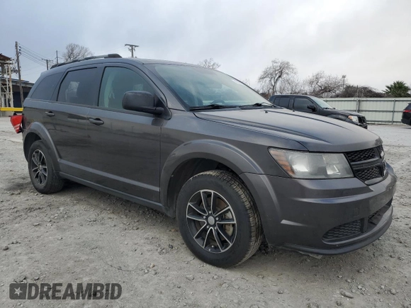2017 Dodge Journey SE with VIN 3C4PDCAB2HT701139, listed as a Copart auction lot 43537005 with 76,530 mi miles and Salvage Title. Bid and sale history available at DreamBid. Image 4.