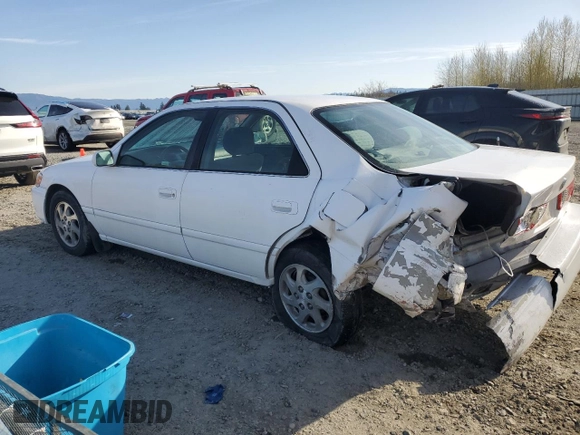 2000 Toyota Camry CE with VIN JT2BG22K0Y0470743, listed as a Copart auction lot 51980385 with 300,464 mi miles and Salvage Title. Bid and sale history available at carsss.com. Image 2.