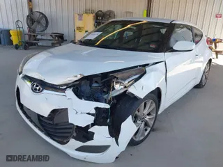2016 Hyundai Veloster with VIN KMHTC6AD5GU268842, listed as a IAAI auction lot 41672376 with 156,703 mi miles. Bid and sale history available at carsss.com. Image 2.