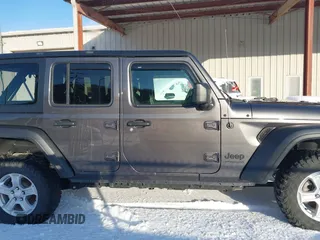 2022 Jeep Wrangler Unlimited Sport with VIN 1C4HJXDG5NW157317, listed as a IAAI auction lot 41374590 with 67,632 mi miles and . Bid and sale history available at DreamBid. Image 14.