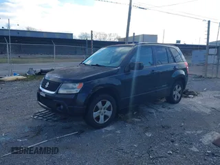 2010 Suzuki Grand Vitara with VIN JS3TE0D4XA4100453, listed as a IAAI auction lot 41603012 with 210,039 mi miles and . Bid and sale history available at DreamBid. Image 2.