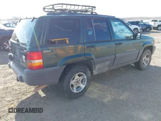 1998 Jeep Grand Cherokee Laredo with VIN 1J4GZ58S5WC362365, listed as a IAAI auction lot 41891397 with 246,673 mi miles. Bid and sale history available at carsss.com. Image 4.