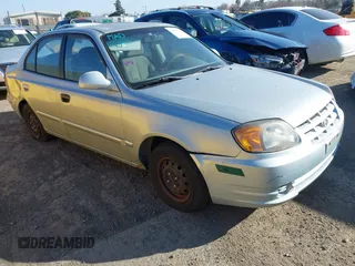 2004 Hyundai Accent GL with VIN KMHCG45C14U547954, listed as a IAAI auction lot 41350219 with 138,436 mi miles. Bid and sale history available at carsss.com. Image 1.