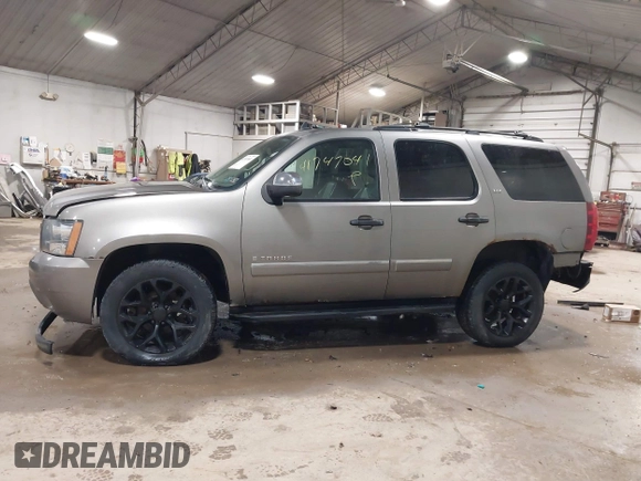 2009 Chevrolet Tahoe LTZ with VIN 1GNFK33049R143390, listed as a IAAI auction lot 41747041 with 209,492 mi miles and . Bid and sale history available at DreamBid. Image 14.
