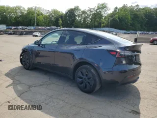 2024 Tesla Model Y Long Range z VIN 7SAYGDEE9RF186388, wystawiony jako Copart lot #58471595 z przebiegiem 23 185 mil mil oraz Szkoda całkowita • Salvage title. Historia ofert i sprzedaży dostępna na DreamBid. Obrazek 2.