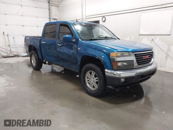 2011 GMC Canyon SLT with VIN 1GTH6NFP8B8115436, listed as a IAAI auction lot 41676023 with 148,478 mi miles. Bid and sale history available at carsss.com. Image 1.
