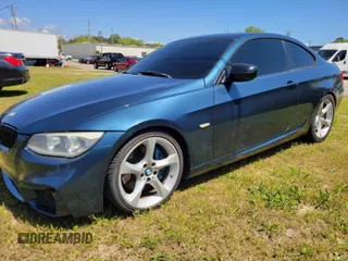 2012 BMW 3 Series 335i with VIN WBAKG7C51CE802713, listed as a IAAI auction lot 42032267 with 124,349 mi miles. Bid and sale history available at carsss.com. Image 1.
