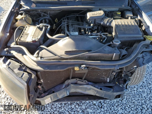 2001 Jeep Grand Cherokee Laredo z VIN 1J4GW48S91C578800, wystawiony jako Copart lot #87934695 z przebiegiem 250 784 mil mil oraz Szkoda całkowita • Salvage title. Historia ofert i sprzedaży dostępna na DreamBid. Obrazek 11.
