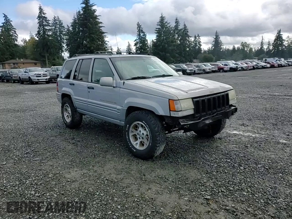 1997 Jeep Grand Cherokee Limited with VIN 1J4GZ78Y5VC598822, listed as a Copart auction lot 74306474 with 276,454 mi miles and Salvage Title. Bid and sale history available at carsss.com. Image 11.