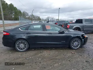 2014 Ford Fusion SE Hybrid with VIN 3FA6P0LU2ER133294, listed as a IAAI auction lot 41696064 with 150,537 mi miles. Bid and sale history available at carsss.com. Image 13.