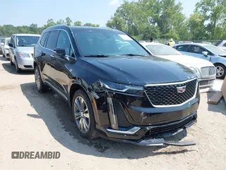 2021 Cadillac XT6 Premium Luxury with VIN 1GYKPDRS0MZ153523, listed as a IAAI auction lot 42770895 with 19,843 mi miles and . Bid and sale history available at DreamBid. Image 1.