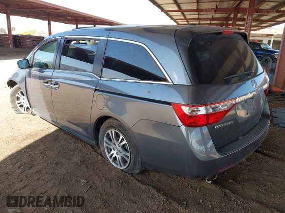 2012 Honda Odyssey EX-L with VIN 5FNRL5H6XCB103498, listed as a IAAI auction lot 42065658 with 104,933 mi miles and . Bid and sale history available at carsss.com. Image 3.