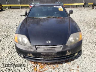 2003 Hyundai Tiburon GT z VIN KMHHN65F13U084620, wystawiony jako Copart lot #46880185 z przebiegiem Nie podano mil oraz Nie do naprawy • Non repairable. Historia ofert i sprzedaży dostępna na DreamBid. Obrazek 5.