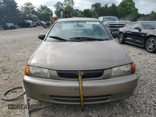 1997 Mazda Protege DX z VIN JM1BC1414V0103244, wystawiony jako Copart lot #56219745 z przebiegiem Nie podano mil oraz Szkoda całkowita • Salvage title. Historia ofert i sprzedaży dostępna na DreamBid. Obrazek 5.