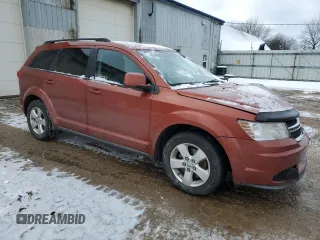 2013 Dodge Journey SE Plus with VIN 3C4PDCABXDT613045, listed as a Copart auction lot 88602235 with 255,617 mi miles and Salvage title. Bid and sale history available at DreamBid. Image 4.