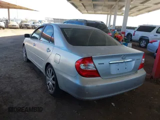 2003 Toyota Camry LE with VIN JTDBE32K730176610, listed as a IAAI auction lot 41627010 with 238,502 mi miles and . Bid and sale history available at DreamBid. Image 3.