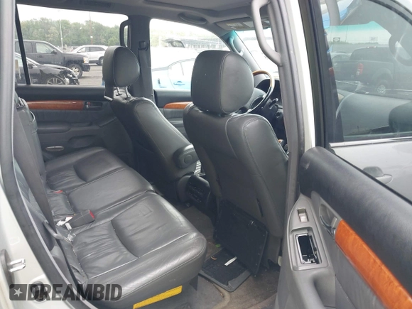 2004 Lexus GX 470 with VIN JTJBT20XX40032417, listed as a IAAI auction lot 42150885 with 180,568 mi miles. Bid and sale history available at carsss.com. Image 8.