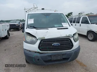 2016 Ford Transit Cargo with VIN 1FTYE1ZM6GKA95971, listed as a IAAI auction lot 42412181 with 243,171 mi miles and . Bid and sale history available at DreamBid. Image 6.