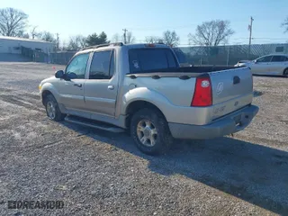 2003 Ford Explorer Sport Trac XLS with VIN 1FMZU77E13UC07611, listed as a IAAI auction lot 41401679 with 244,126 mi miles. Bid and sale history available at carsss.com. Image 3.