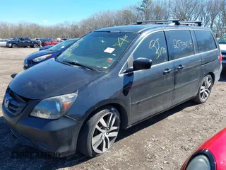 2009 Honda Odyssey EX-L with VIN 5FNRL38759B055396, listed as a IAAI auction lot 41863703 with 999,999 mi miles. Bid and sale history available at carsss.com. Image 2.