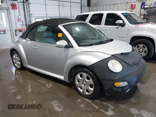 2003 Volkswagen Beetle GLS z VIN 3VWCK21Y53M311932, wystawiony jako IAAI lot #42467585 z przebiegiem 145 346 mil mil oraz . Historia ofert i sprzedaży dostępna na DreamBid. Obrazek 1.