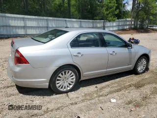 2010 Ford Fusion Hybrid с VIN 3FADP0L33AR171285, выставлен на аукционе Copart как лот 64983995 с пробегом 166 596 миль миль и Чистый • Clean title. История ставок и продаж доступна на DreamBid. Изображение 3.