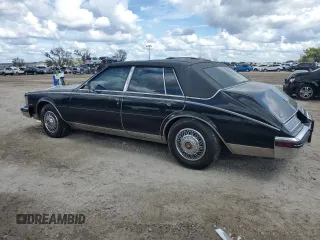 1984 Cadillac Seville z VIN 1G6AS6988EE829387, wystawiony jako Copart lot #75061224 z przebiegiem 643 mil mil oraz Szkody całkowita. Historia ofert i sprzedaży dostępna na DreamBid. Obrazek 2.