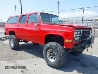 1991 GMC Suburban z VIN 1GKGR26N7MF513031, wystawiony jako IAAI lot #42179575 z przebiegiem 68 871 mil mil oraz . Historia ofert i sprzedaży dostępna na DreamBid. Obrazek 1.