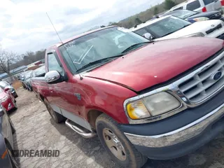 1999 Ford F-150 Work Series with VIN 1FTRF17W0XNB51584, listed as a IAAI auction lot 41872666 with 157,848 mi miles. Bid and sale history available at carsss.com. Image 1.