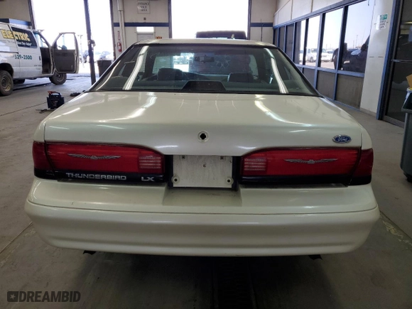 1995 Ford Thunderbird LX with VIN 1FALP62W9SH159185, listed as a Copart auction lot 51862975 with 128,230 mi miles and Clean Title. Bid and sale history available at carsss.com. Image 6.