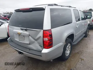 2011 Chevrolet Suburban LS with VIN 1GNSCHE06BR188407, listed as a IAAI auction lot 41453215 with 232,667 mi miles. Bid and sale history available at carsss.com. Image 4.