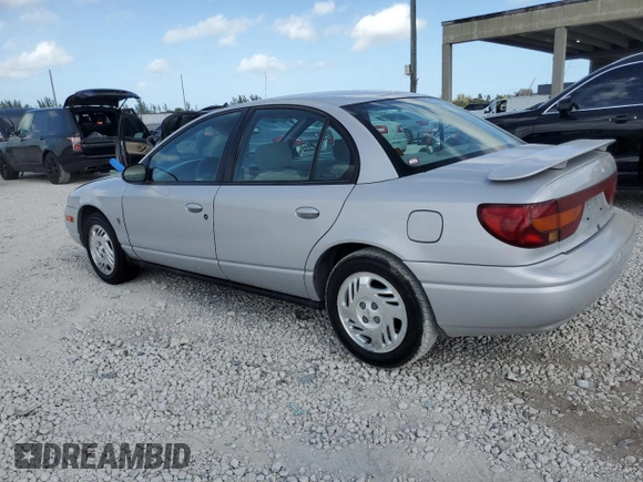 2000 Saturn SL z VIN 1G8ZK5276YZ224500, wystawiony jako Copart lot #45083945 z przebiegiem 130 766 mil mil oraz Szkoda całkowita • Salvage title. Historia ofert i sprzedaży dostępna na DreamBid. Obrazek 2.