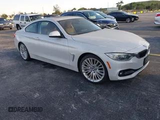 2014 BMW 4 Series 435i with VIN WBA3R1C51EK192795, listed as a IAAI auction lot 41263037 with 22,937 mi miles and . Bid and sale history available at carsss.com. Image 1.