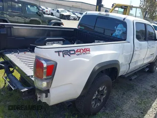 2021 Toyota Tacoma 4WD SR5 with VIN 3TMDZ5BN7MM103321, listed as a IAAI auction lot 41765512 with 49,009 mi miles. Bid and sale history available at carsss.com. Image 4.