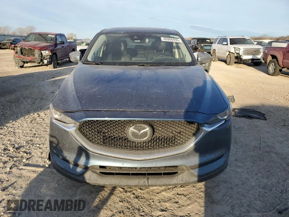 2020 Mazda CX-5 Touring with VIN JM3KFBCM9L0737243, listed as a Copart auction lot 46908495 with 76,956 mi miles and Salvage Title. Bid and sale history available at carsss.com. Image 5.