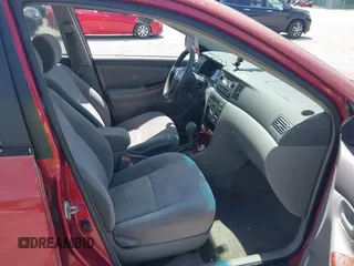 2005 Toyota Corolla CE with VIN 1NXBR32E55Z411298, listed as a IAAI auction lot 42082065 with 220,695 mi miles. Bid and sale history available at carsss.com. Image 5.