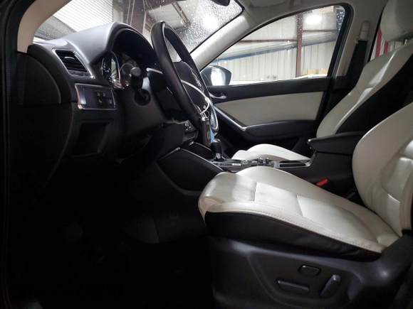 2016 Mazda CX-5 Grand Touring with VIN JM3KE4DY2G0738899, listed as a Copart auction lot 50943255 with 80,807 mi miles and Salvage Title. Bid and sale history available at carsss.com. Image 7.
