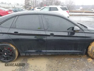 2023 Volkswagen Jetta Sport z VIN 3VWBM7BU2PM028974, wystawiony jako IAAI lot #41547698 z przebiegiem 30 061 mil mil oraz . Historia ofert i sprzedaży dostępna na DreamBid. Obrazek 13.
