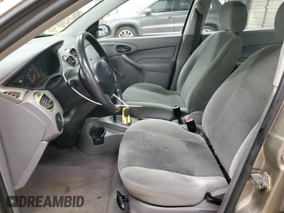 2003 Ford Focus LX with VIN 1FAFP33P63W257719, listed as a Copart auction lot 83937554 with 75,967 mi miles and Salvage Title. Bid and sale history available at carsss.com. Image 7.