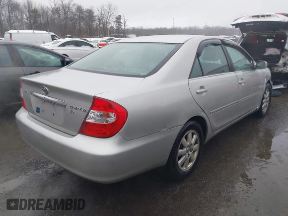 2004 Toyota Camry LE with VIN 4T1BF30K14U578385, listed as a IAAI auction lot 41547709 with 217,434 mi miles. Bid and sale history available at carsss.com. Image 4.