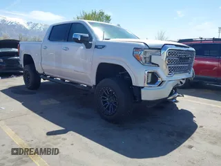 2021 GMC Sierra 1500 Denali with VIN 3GTU9FET7MG422796, listed as a IAAI auction lot 41980530 with 56,087 mi miles and . Bid and sale history available at DreamBid. Image 1.